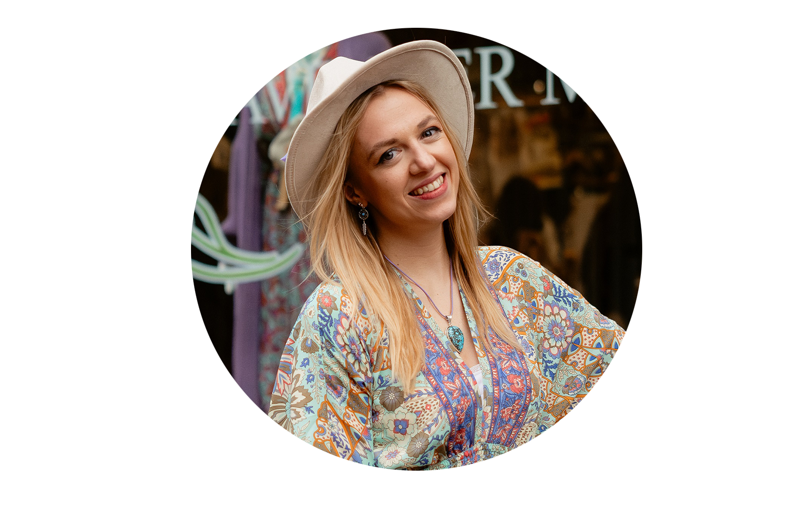 An image of Lavender Moon's owner, Bethany, in a floral dress and straw hat