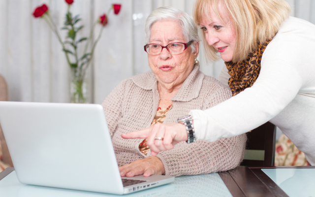 Two women looking at laptop